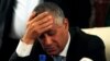 FILE - Libya's Prime Minister Ali Zeidan places his hand on his forehead as he addresses a news conference after his release and arrival at the headquarters of the Prime Minister's Office in Tripoli, Oct. 10, 2013. 