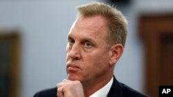 FILE - Acting Defense Secretary Patrick Shanahan listens, May 1, 2019, during a House Appropriations subcommittee budget hearing on Capitol Hill in Washington. 