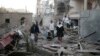 FILE - People inspect the damage of houses destroyed by Saudi-led airstrikes in Sanaa, Yemen, Jun. 9, 2017. 