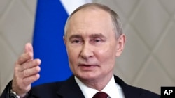 Russian President Vladimir Putin gestures while speaking to the media after the summit of the Collective Security Treaty Organization in Astana, Kazakhstan, Nov. 28, 2024. Putin approved, Dec. 1, 2024, budget plans, raising 2025 military spending to record levels.