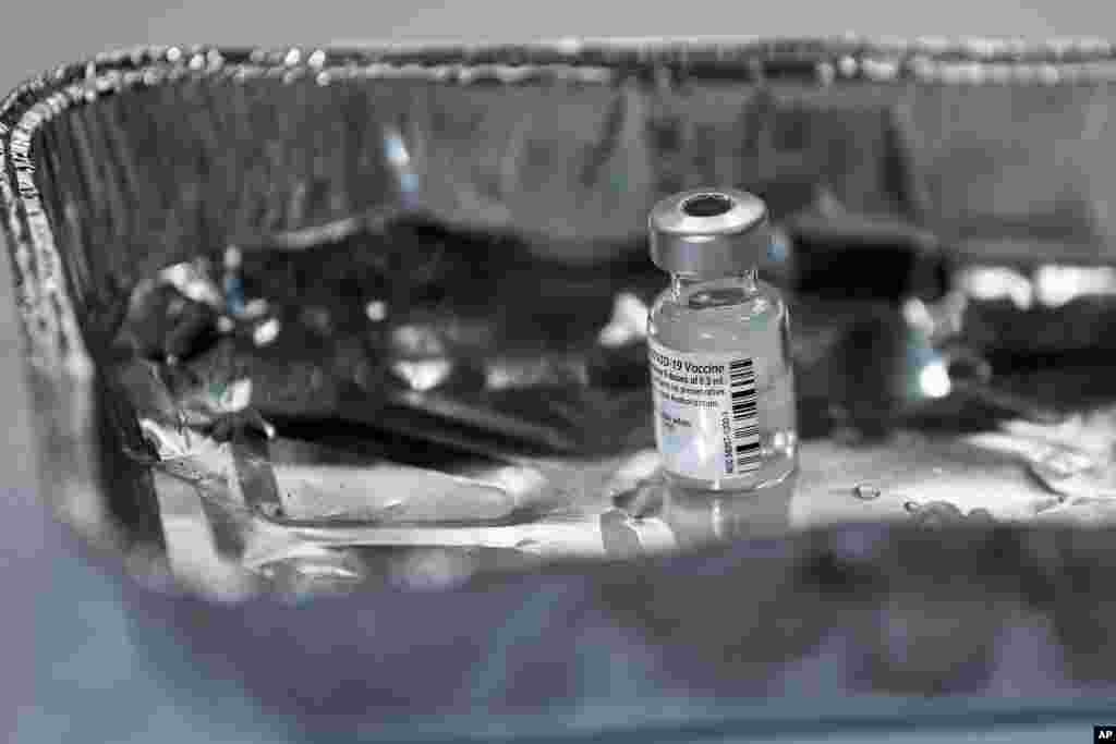 A vial of the Pfizer-BioNTech COVID-19 vaccine, as the mass public vaccination program gets underway, at the NHS Louisa Jordan Hospital in Glasgow, Scotland, Dec. 8, 2020.